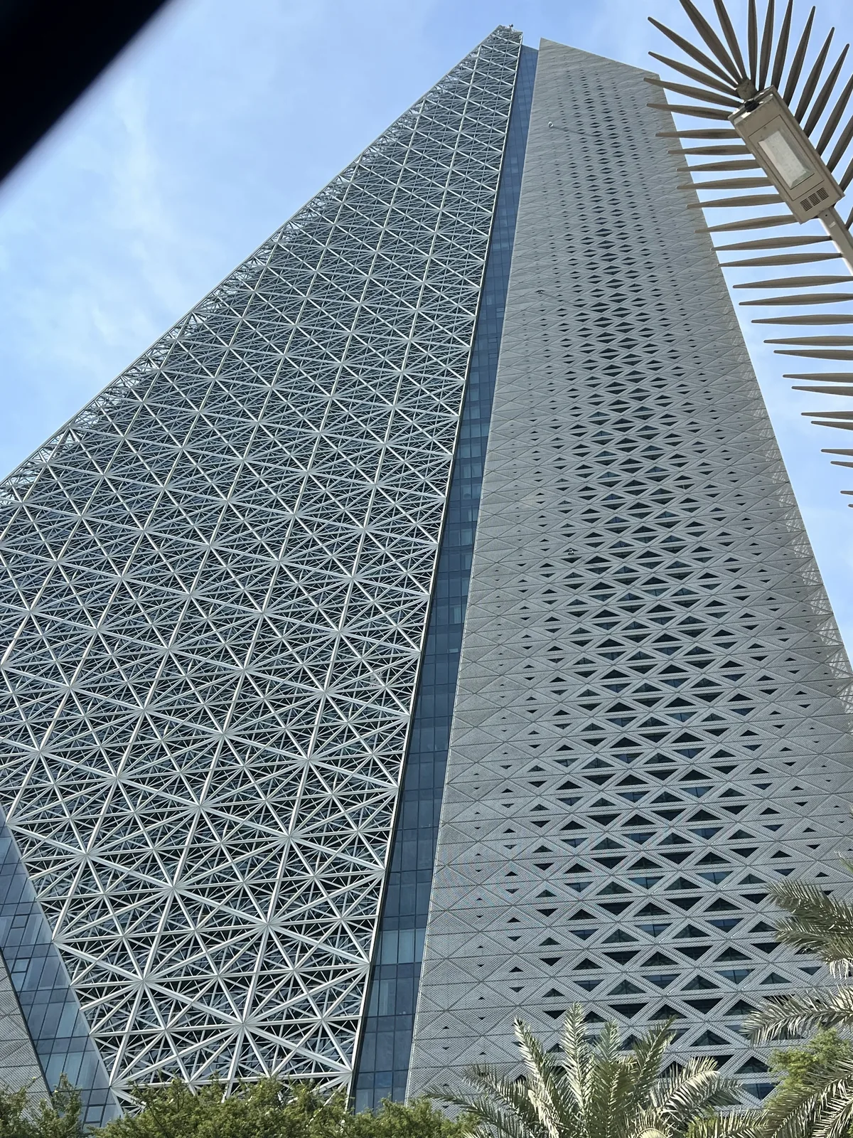 Geometric mashrabiya lattice facade of Burj Doha tower in West Bay, Doha, seen from below