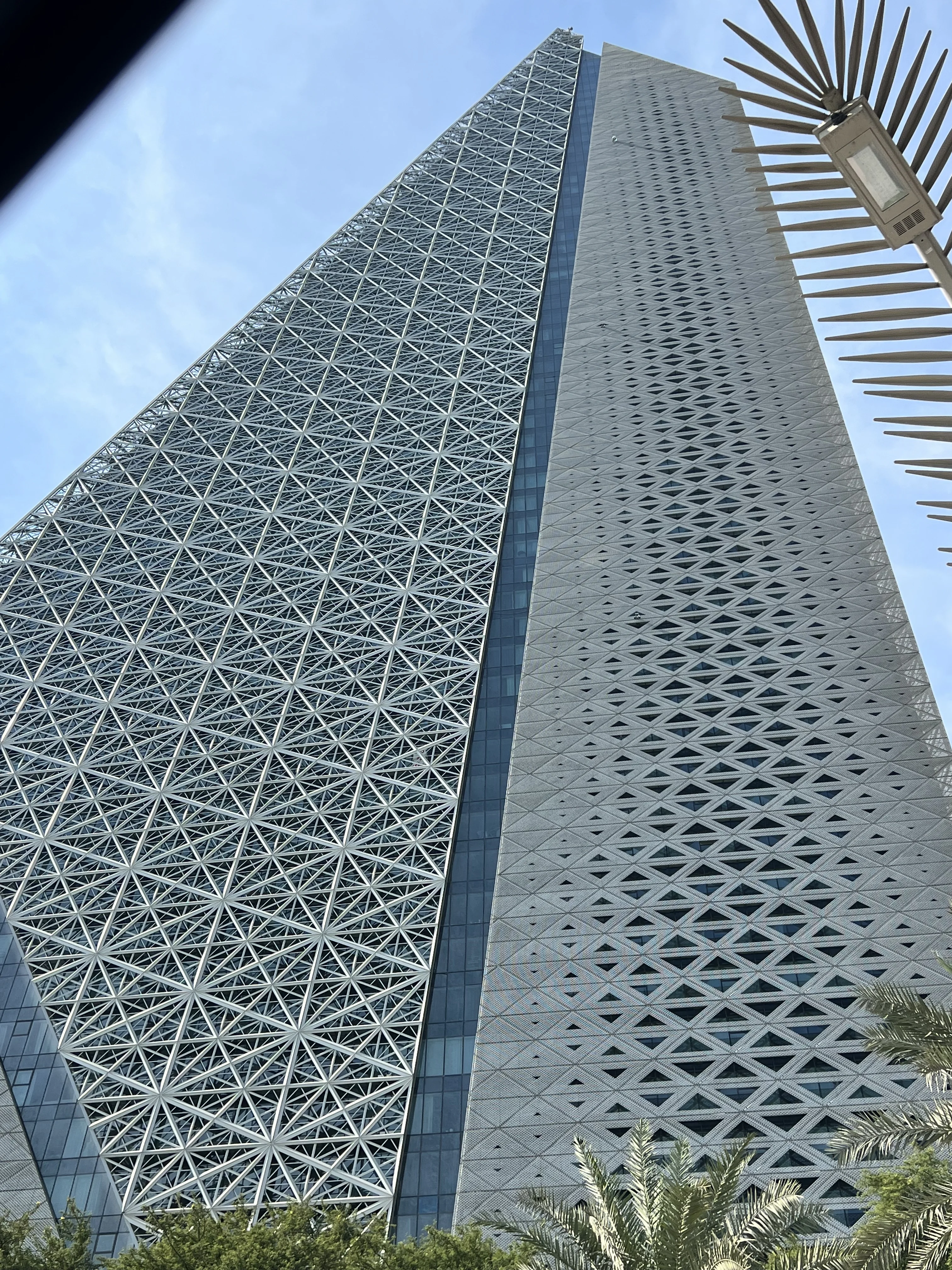 Geometric mashrabiya lattice facade of Burj Doha tower in West Bay, Doha, seen from below