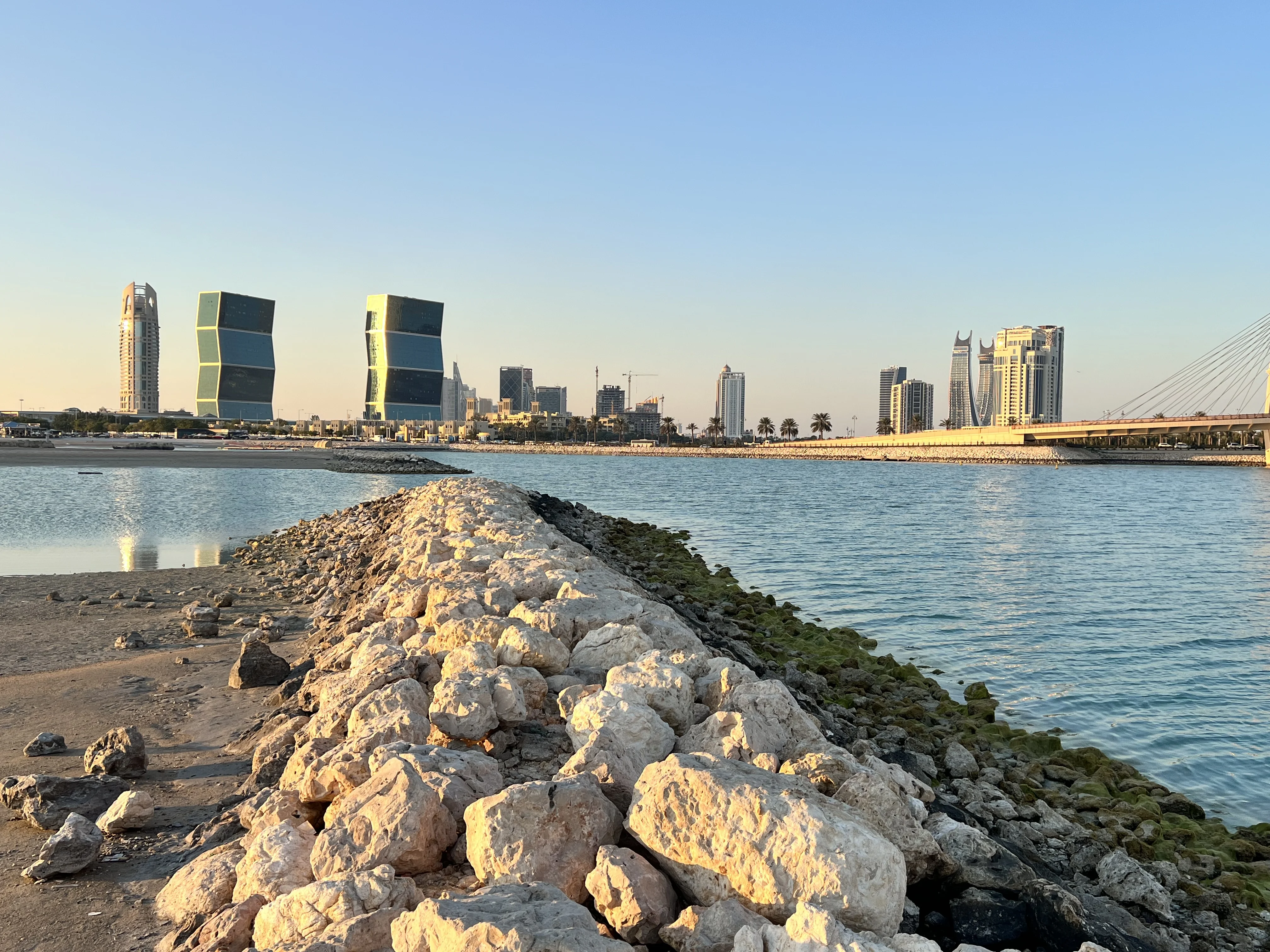 Rocky breakwater path leading into West Bay Lagoon near the Diplomatic Club, Doha