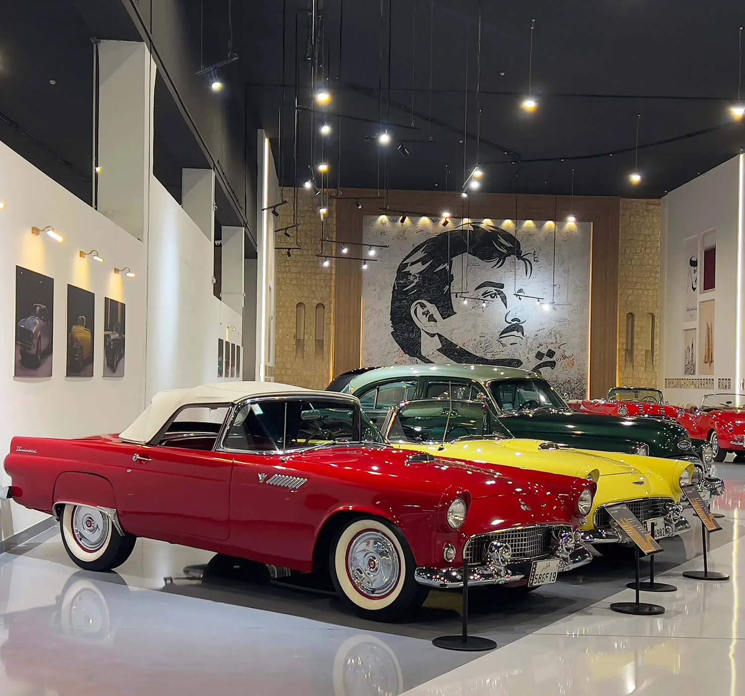 Vintage Ford convertibles in red, yellow and green on display at the FBQ Car Museum