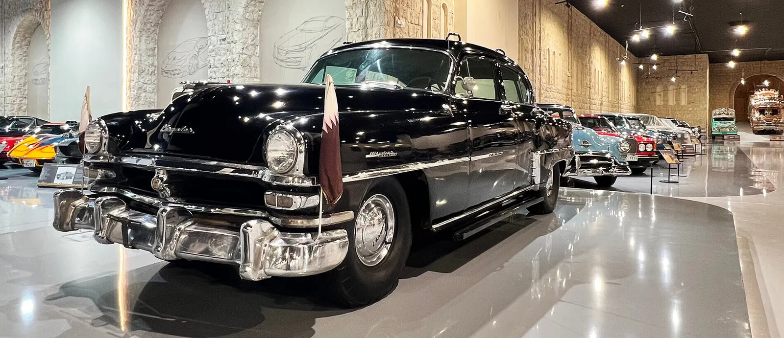Black vintage limousine on display in the museum hall