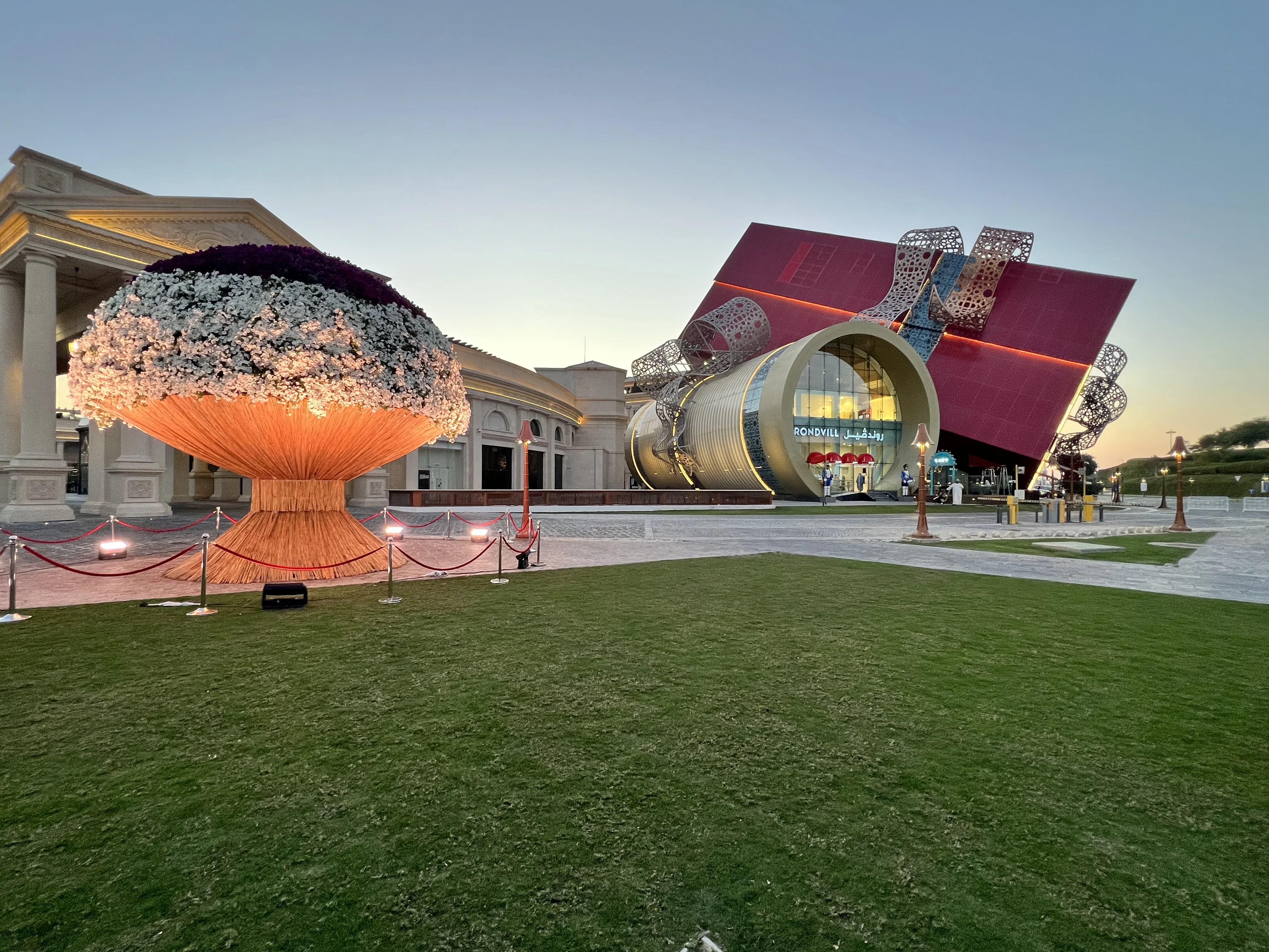 Colourful sculptural art installations along the neoclassical colonnade at 21 High Street, Katara